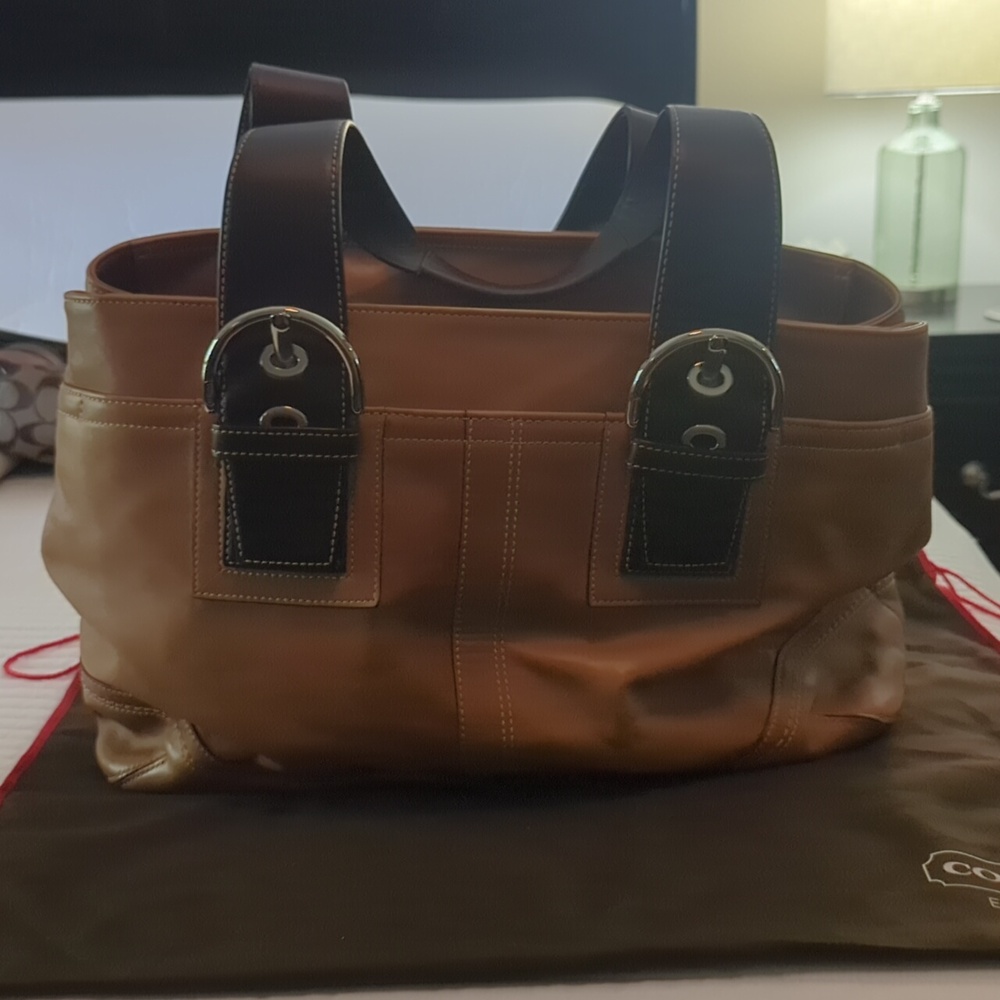 Leather COACH bag and leather Wallet with leather check book cover.